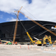 Despite a worker at the site testing positive for coronavirus, construction at the Raiders new stadium is being allowed to continue.